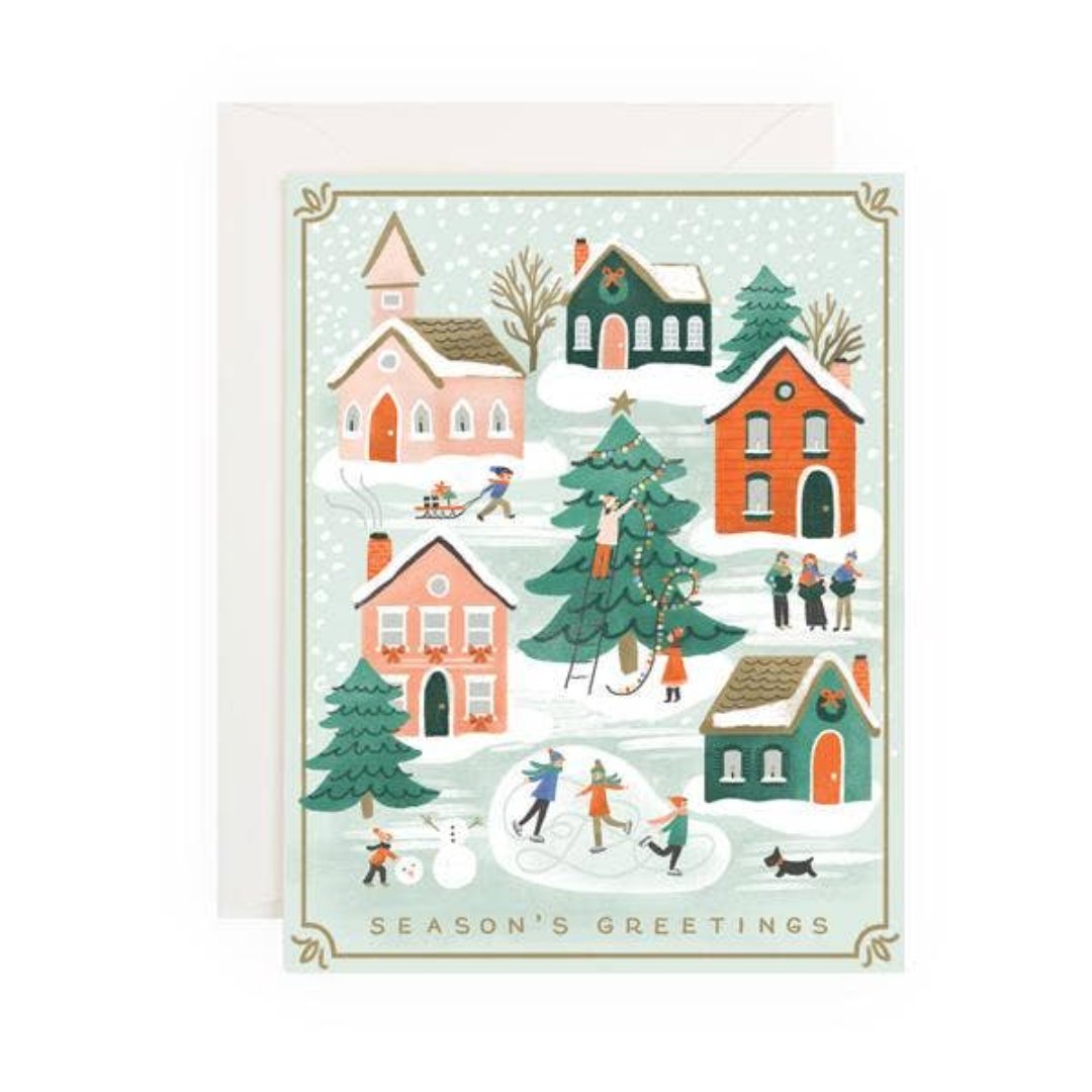 christmas card of a holiday town that says seasons greetings