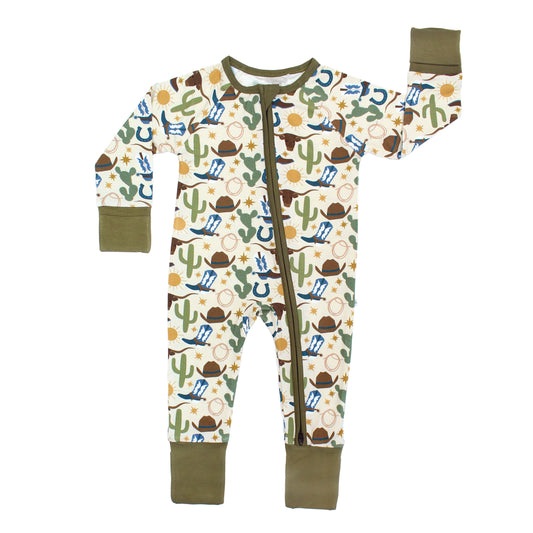 Our Western Howdy Collection! This cozy bamboo convertible pajama features a charming cowboy-themed print with blue boots, cacti, suns, horseshoes, and cowboy hats. 