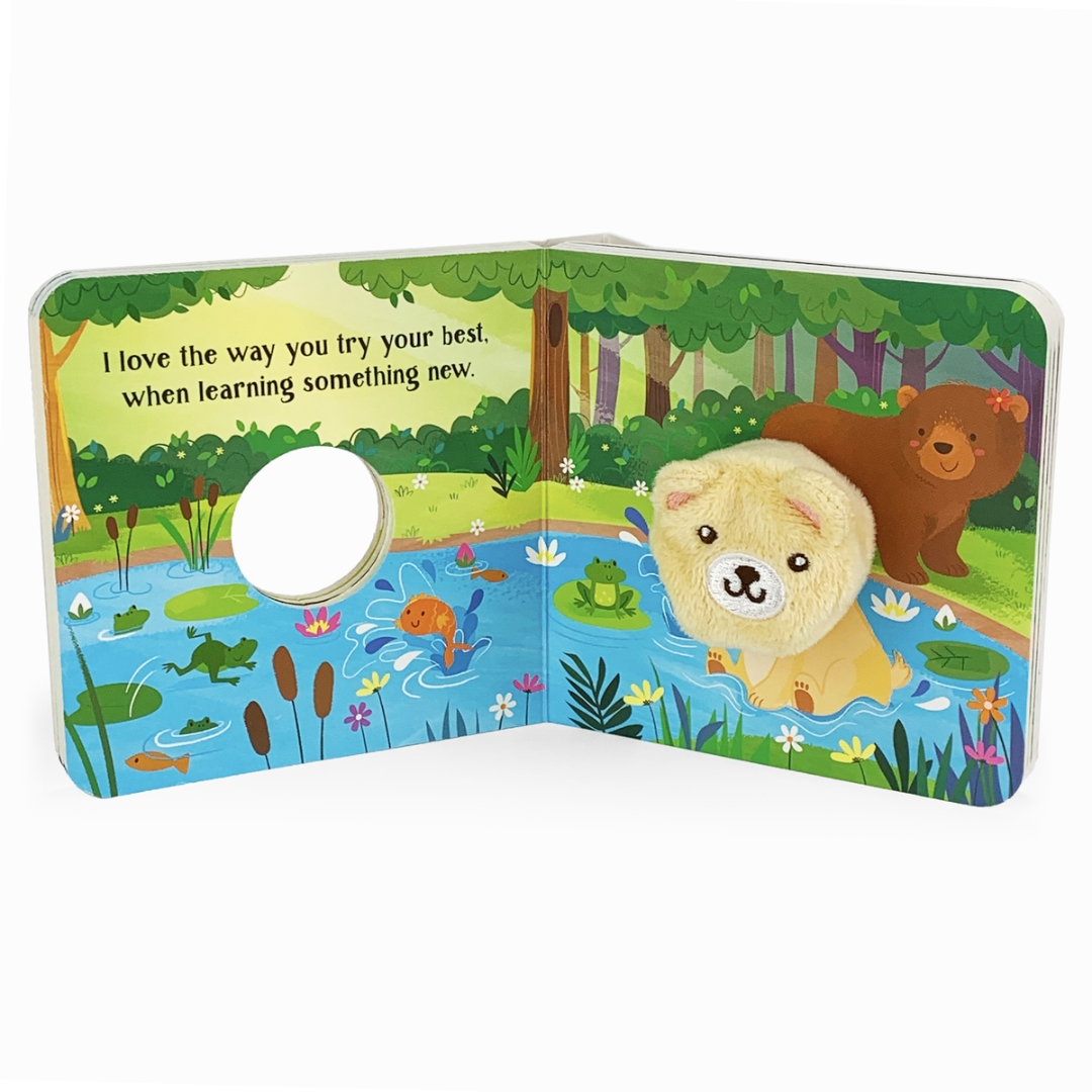 Yellow bear puppet in a board book multi-colored pond and forest scene