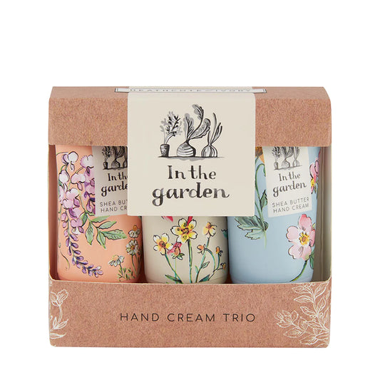 Assorted hand creams in rose, cream, and blue bottles in a rose package