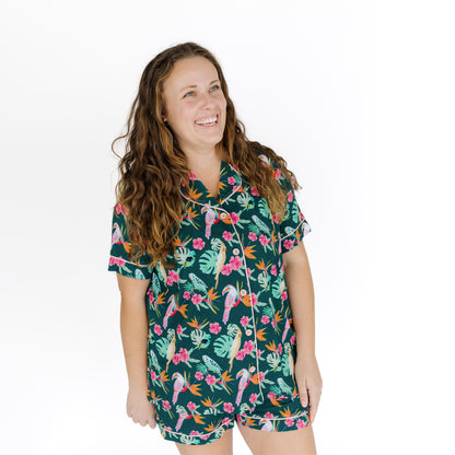 Medium shot of a woman in the tropical botanical print pajama set, highlighting the soft, moisture-wicking fabric.