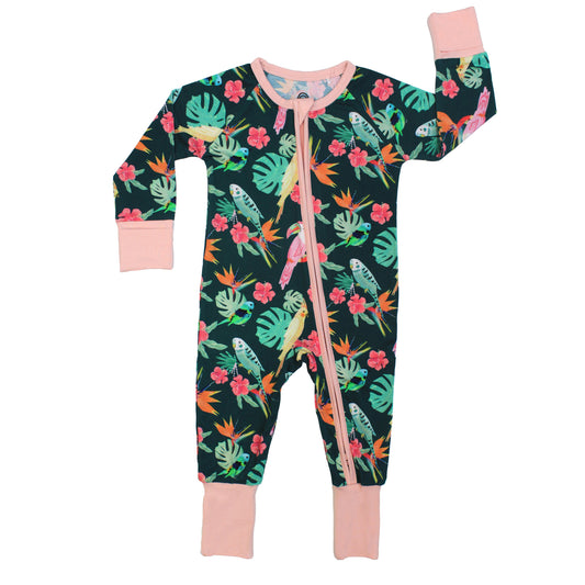 Bamboo convertible footie romper in the Isla Botánica print featuring tropical birds and palm leaves with pink trim.