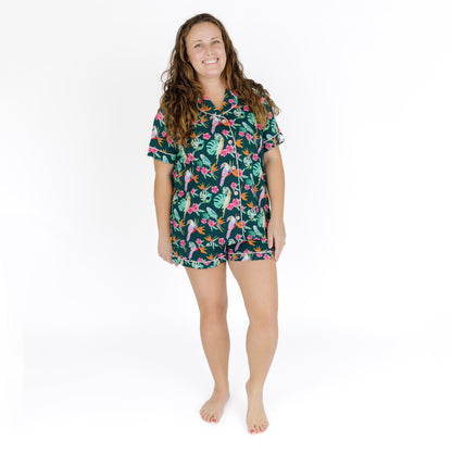 Full body view of a woman wearing the Isla Botánica shorts set, demonstrating the comfortable elastic waistband and pockets.