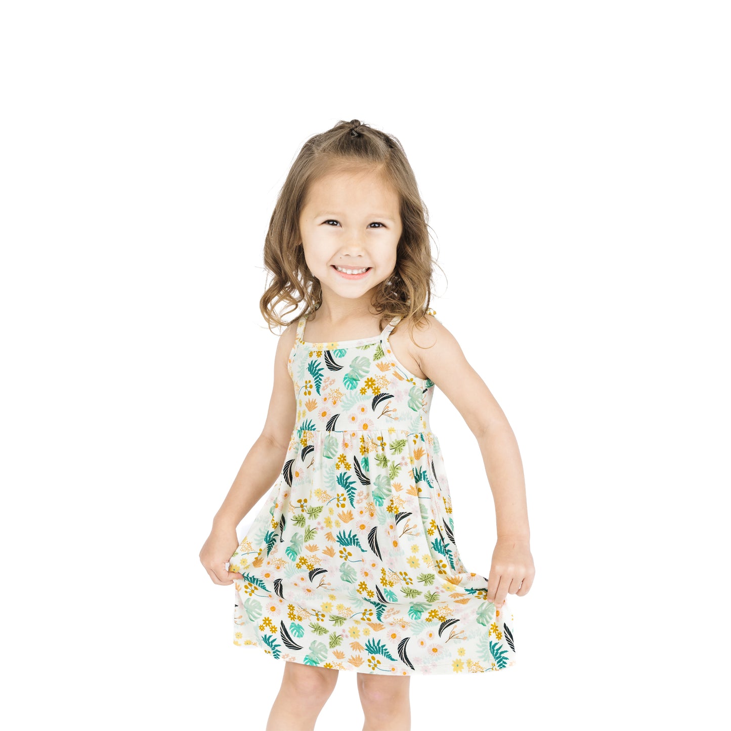 Full-length view of a child in the Tropical Blooms sundress, highlighting the lightweight, breathable fabric and twirl-worthy fit.