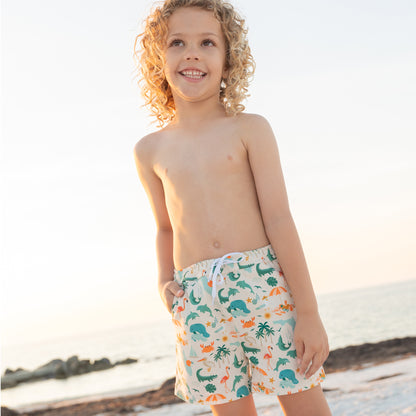 Medium shot of a boy in Explore Florida swim trunks, highlighting the breathable and lightweight fabric perfect for swimming and playing.