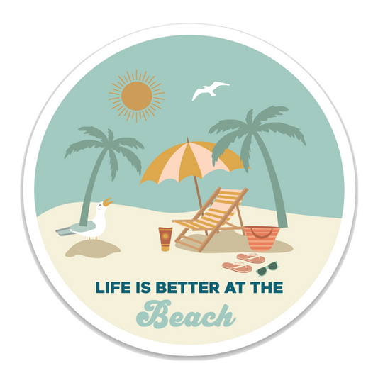 the phrase "life is better at the beach" is printed at the bottom of the sticker. the typical beach set up of a chair, umbrella, bag, flip-flops, and water cup are printed above the phrase. there is a beach background.