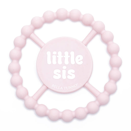 light pink round silicone baby teether that says little sis in white