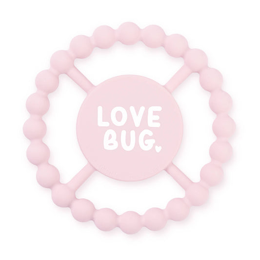 light pink round teether that says love bug in white letters