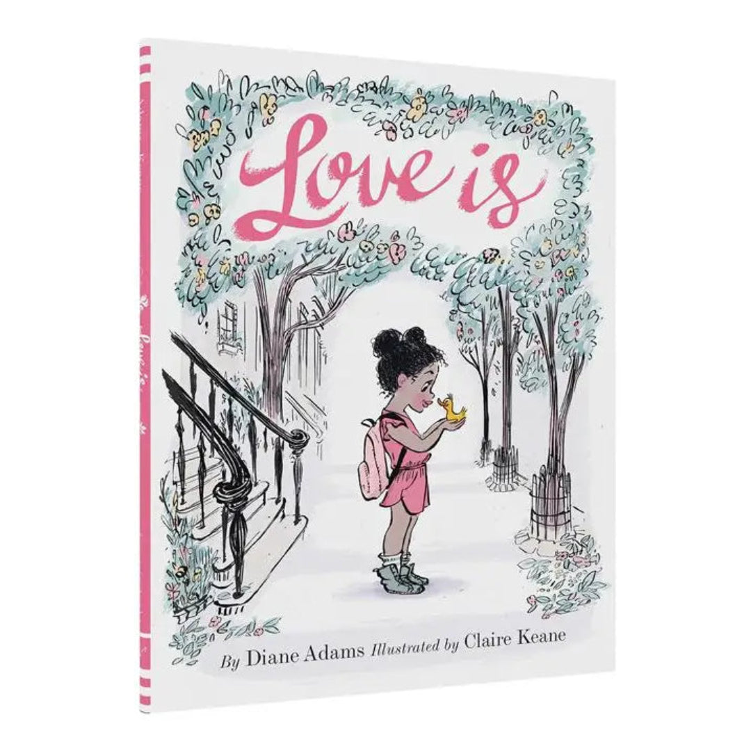 a hard cover book called love is and it has a little girl on the front cover holding a duckling outside of a home with lots of trees