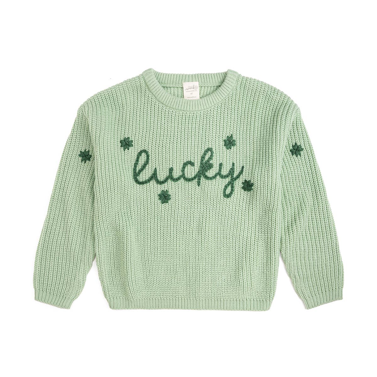 Green knitted sweater with 'lucky' and clover designs on a white background