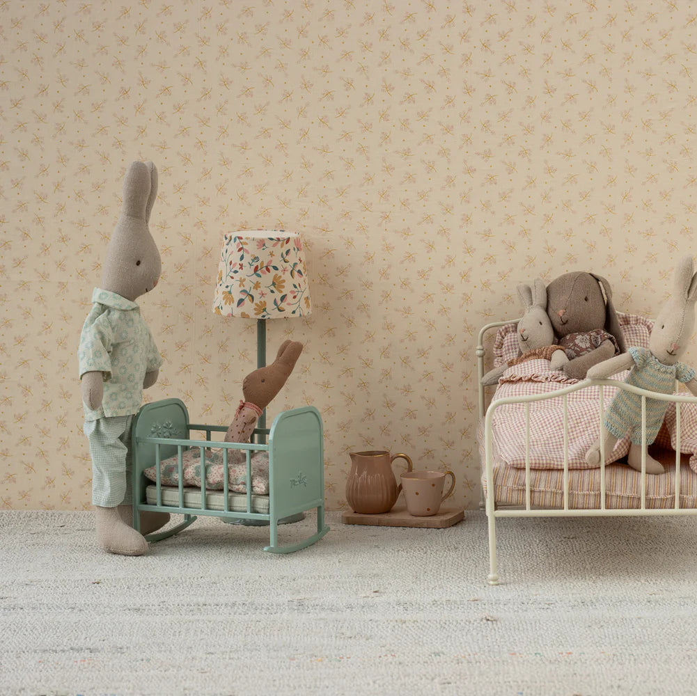 Children's room with toy rabbits in a bedroom setting.