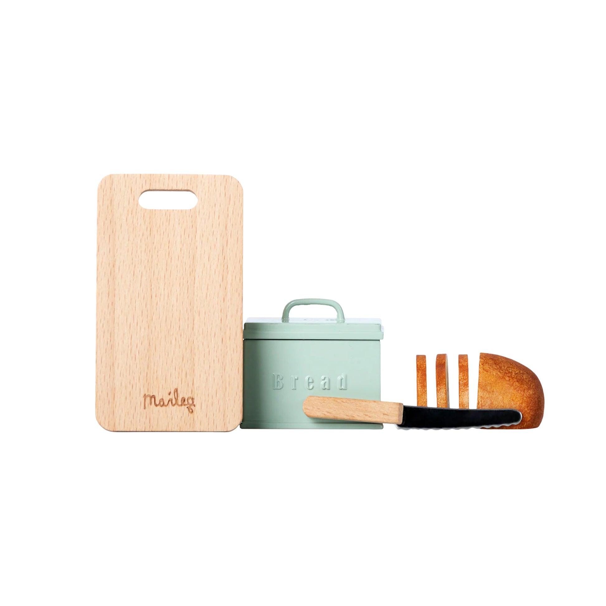 Wooden cutting board, green bread container, and wooden spoon on a white background
