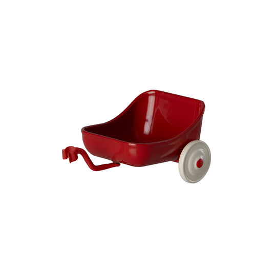Red toy wagon with a white wheel on a white background