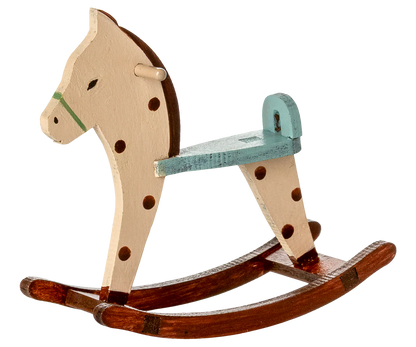 Wooden rocking horse with a white background