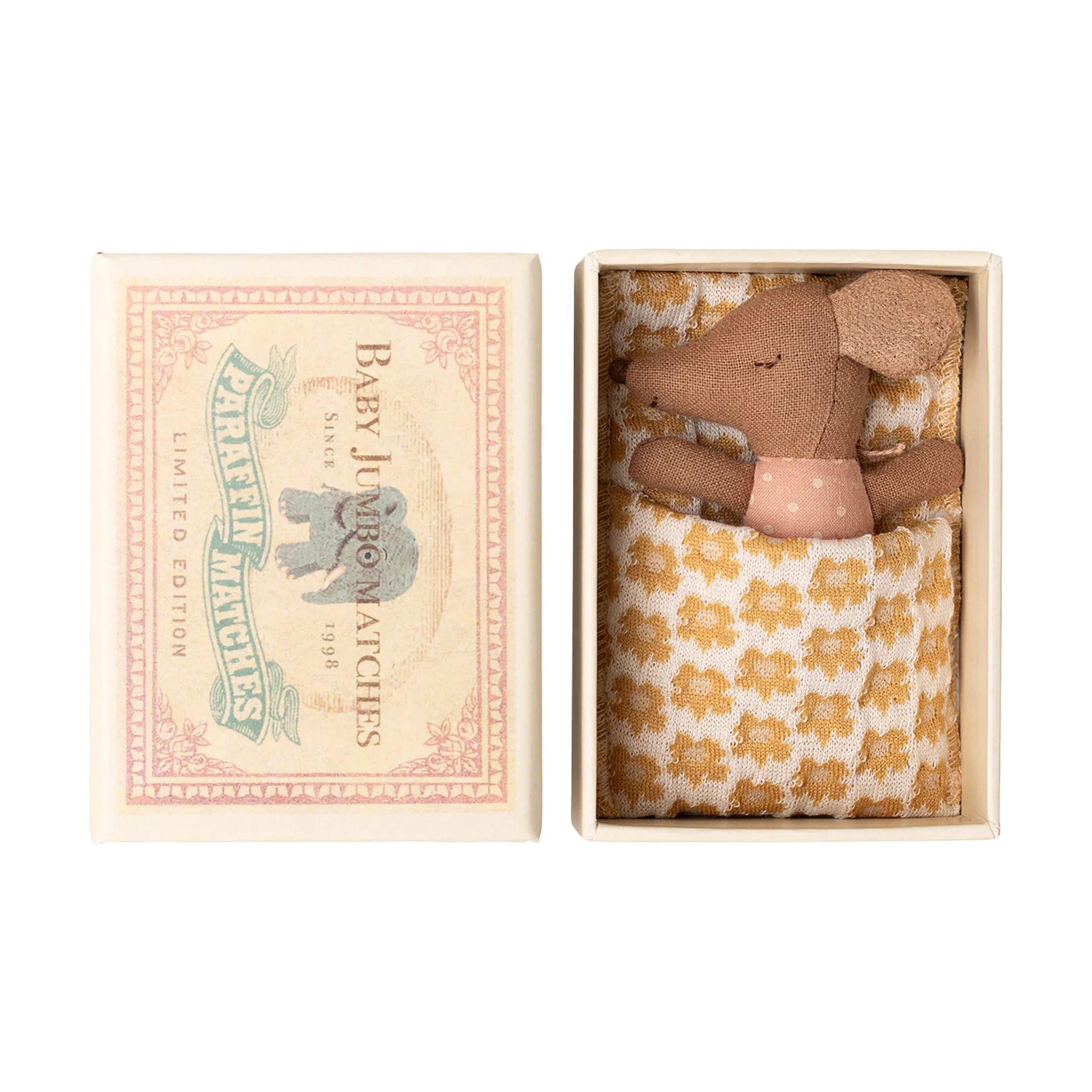 Adorable Maileg baby mouse in a pink spotted suit with her own matchbox bed. Features a reversible sleepy/wakey face for imaginative play.