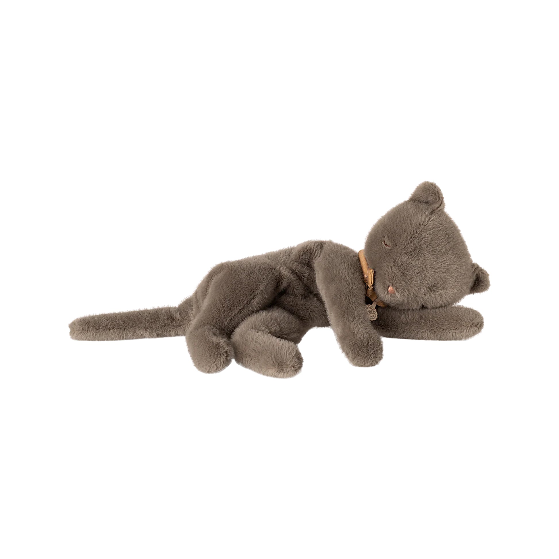 Plush toy dog lying on a white background