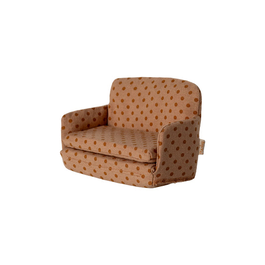 Brown polka dot armchair on a white background