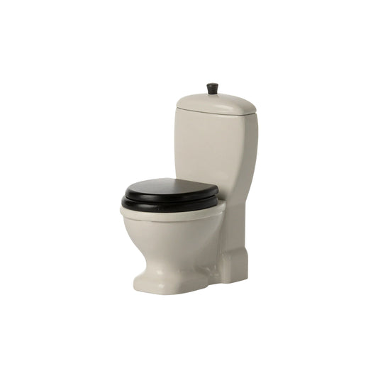 Beige toilet with black seat on a white background
