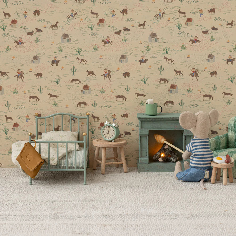 Children's room with toy mouse by a fireplace, patterned wallpaper with animals and plants.