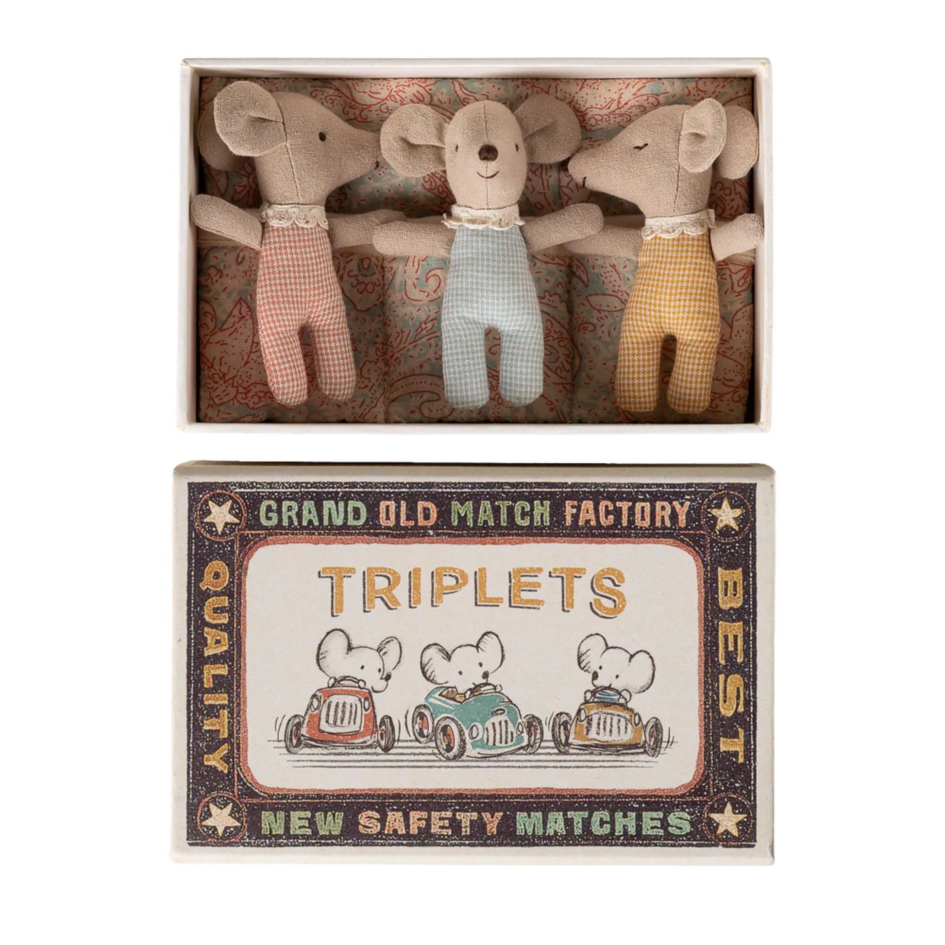 Three stuffed animal toys in a matchbox with a vintage-style label.