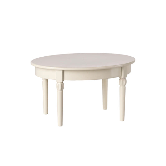 Round white table with four legs on a white background
