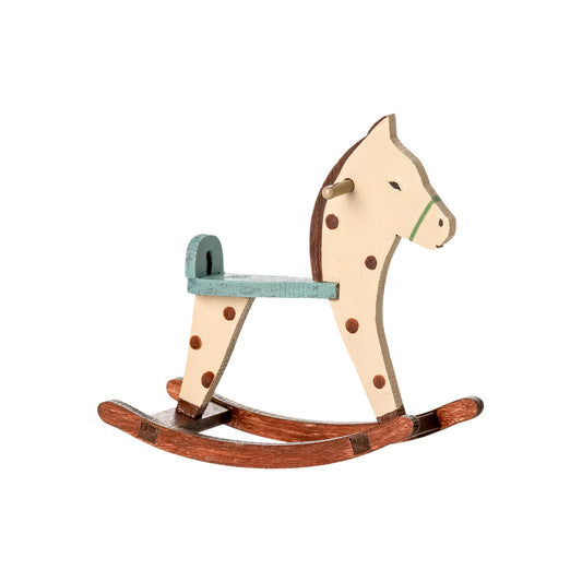 Wooden rocking horse with polka dot pattern on a white background