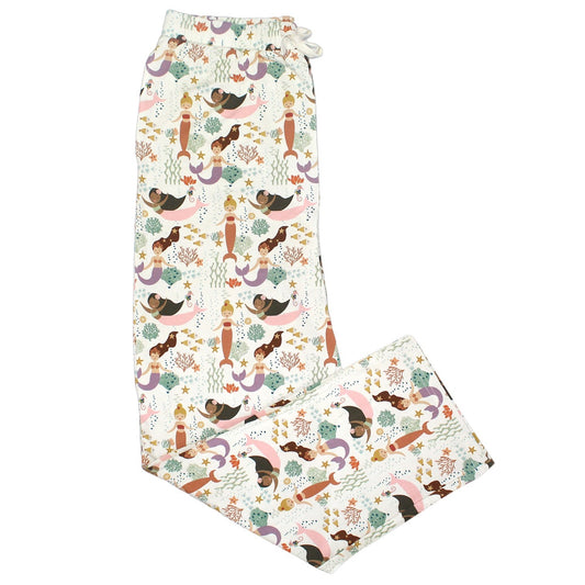the "making waves" relaxed pants. the "making waves" print has a diverse spread of mermaids, sea coral, starfish, fish, and bubbles all spread out in different colors. this is all put on a beige background.