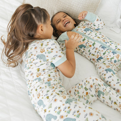 Close up of kids smiling in manatee bamboo pajamas soft breathable fabric for sensitive skin