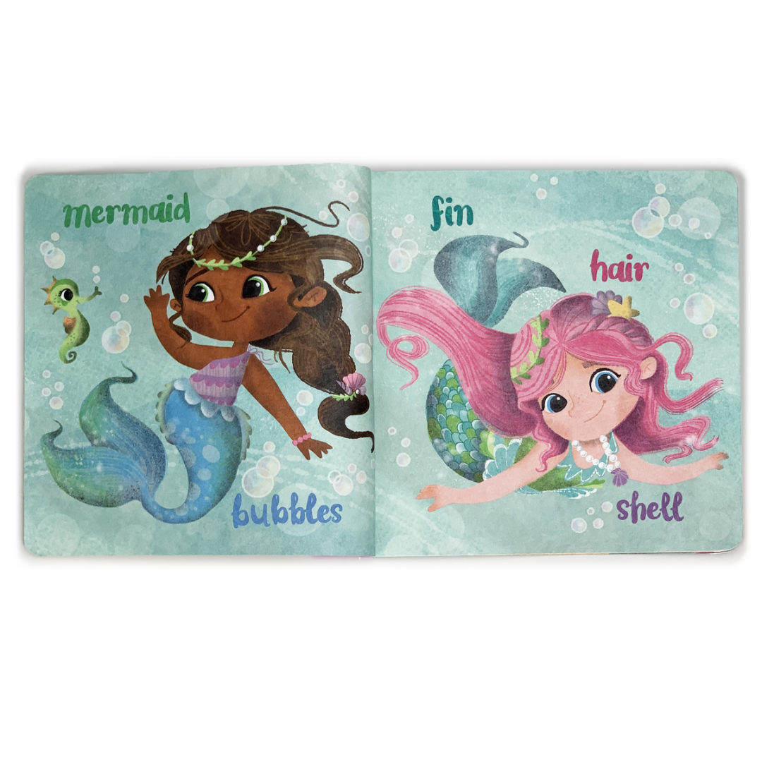 Two multi-colored mermaids and a sea horse underwater on book pages