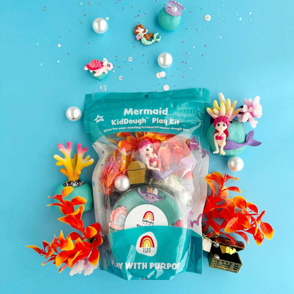 Mermaid-themed kid dough play kit with figurines and accessories on a blue background