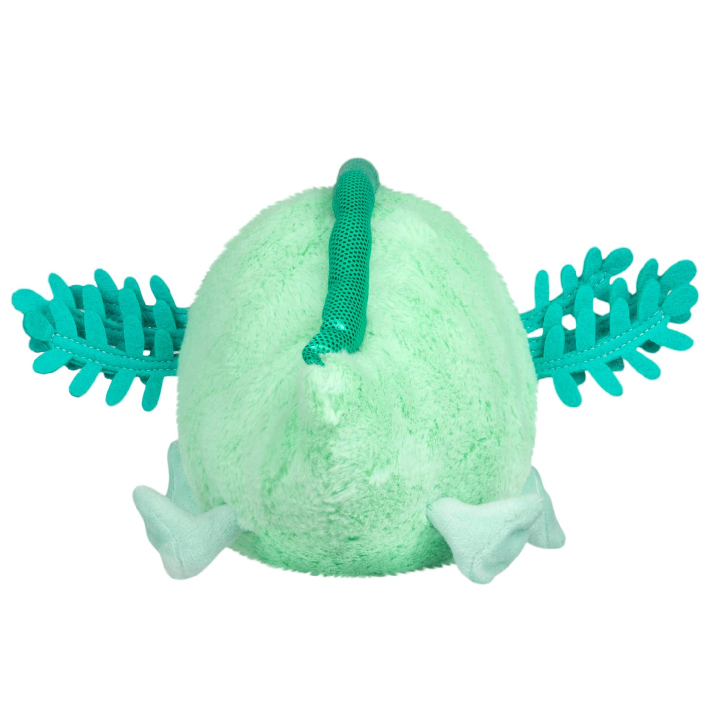 Green plush toy with leaf-like appendages on a white background