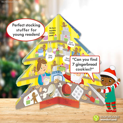 a book thats shaped like a christmas tree and there is a real christmas tree in the background