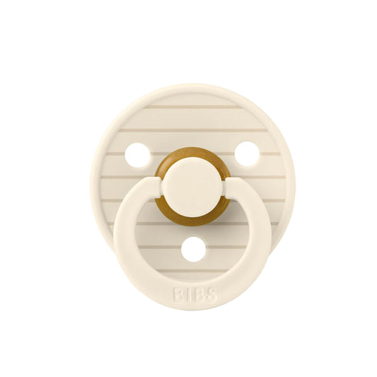 Beige pacifier with gold center on a white background