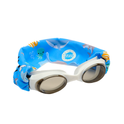 white swimming goggles with a blue fabric band around the strap with friendly sea creatures on it