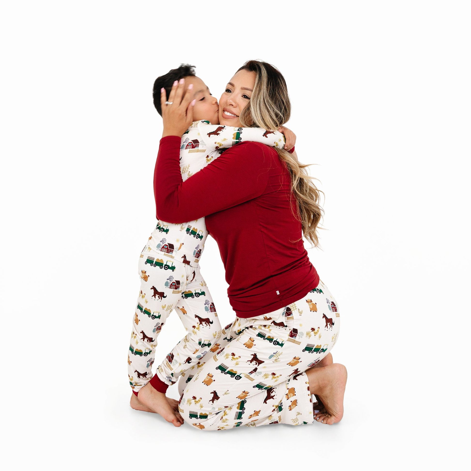Mother and child in matching On the Farm bamboo pajamas, soft breathable lounge pants with farm print, perfect for family matching sets.