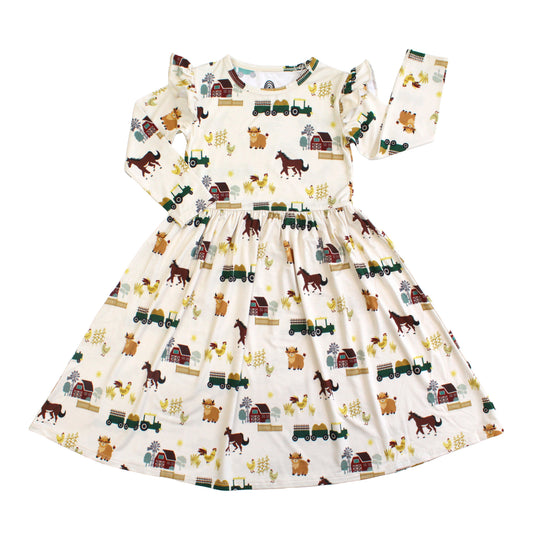 On the Farm bamboo ruffled long sleeve twirl dress with horse and tractor farm print, soft, breathable, and hypoallergenic for sensitive skin.