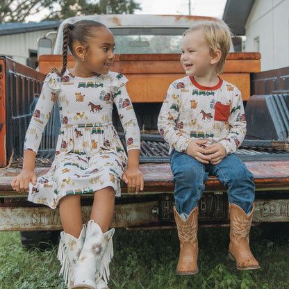 Siblings in matching On the Farm bamboo pocket tees ad twirl dress with horse and tractor farm print, soft, breathable, and gentle on sensitive skin.