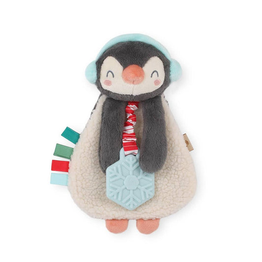 penguin plush toy with a teether attached thats shaped like a snowflake