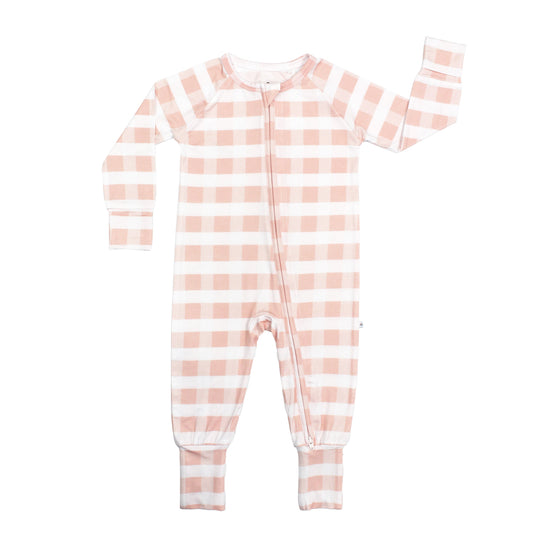 Pink and white striped baby onesie on a white background