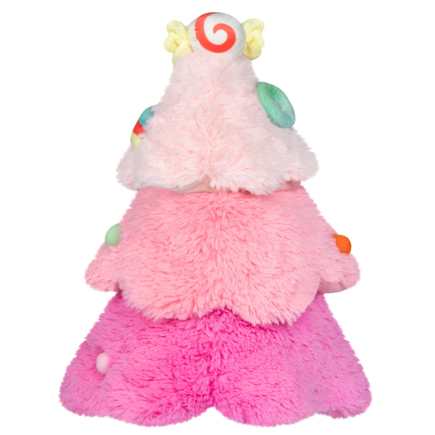Plush toy shaped like a pink tree with a smiling face on a white background