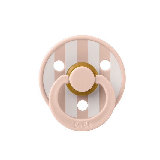 Pink and gold pacifier with striped pattern on a white background