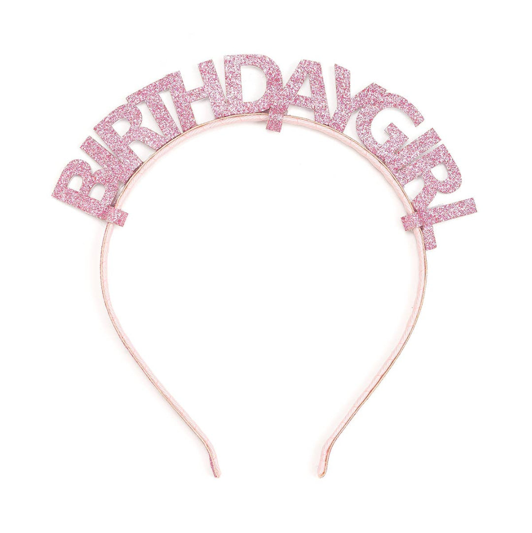 pink headband with glittery letters saying birthday girl on the top