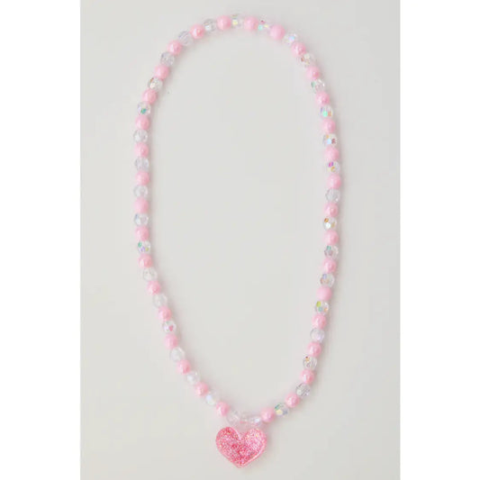 pink and clear beaded necklace with a pink glitter charm on the bottom