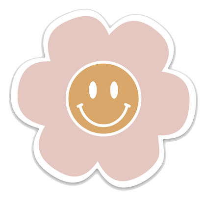 pink flower with a yellow smiley face in the middle. 