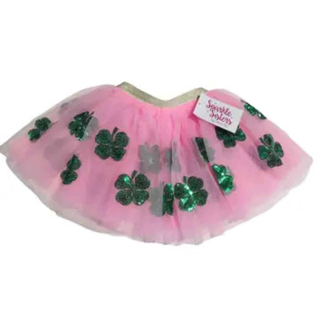 pink tutu with a gold waist band and green sequin shamrocks on it