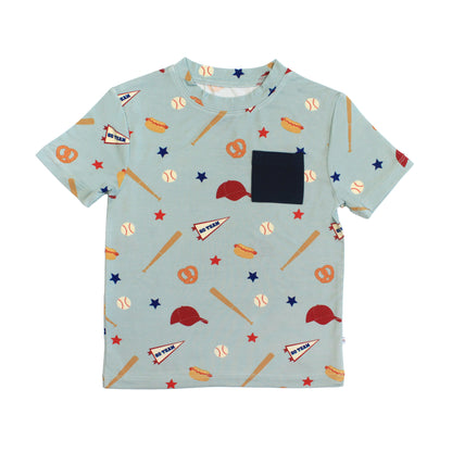 Children's t-shirt with sports-themed pattern on a light blue background