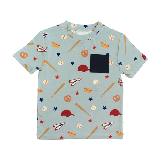 Children's t-shirt with sports-themed pattern on a light blue background