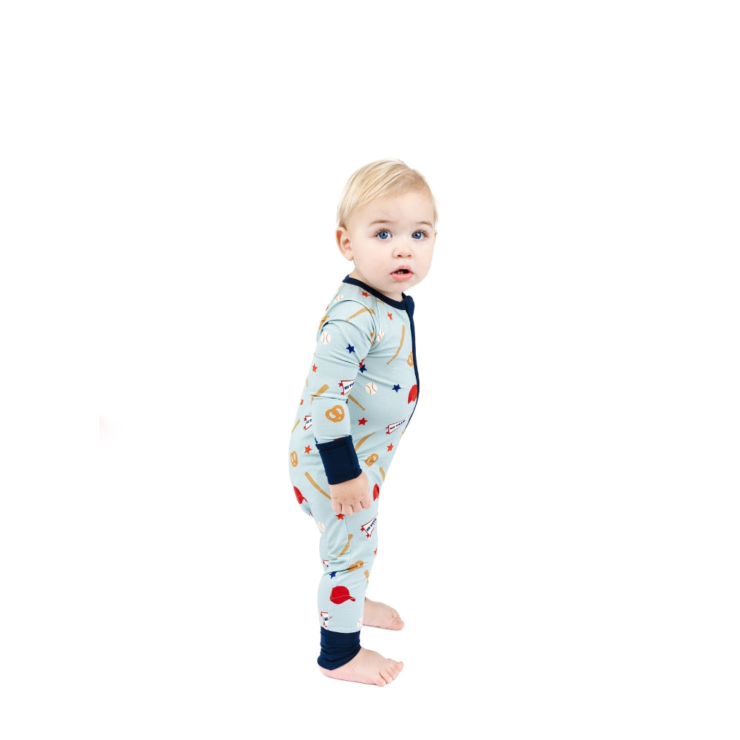 Baby wearing a colorful onesie with a white background