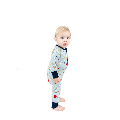 Baby wearing a colorful onesie with a white background