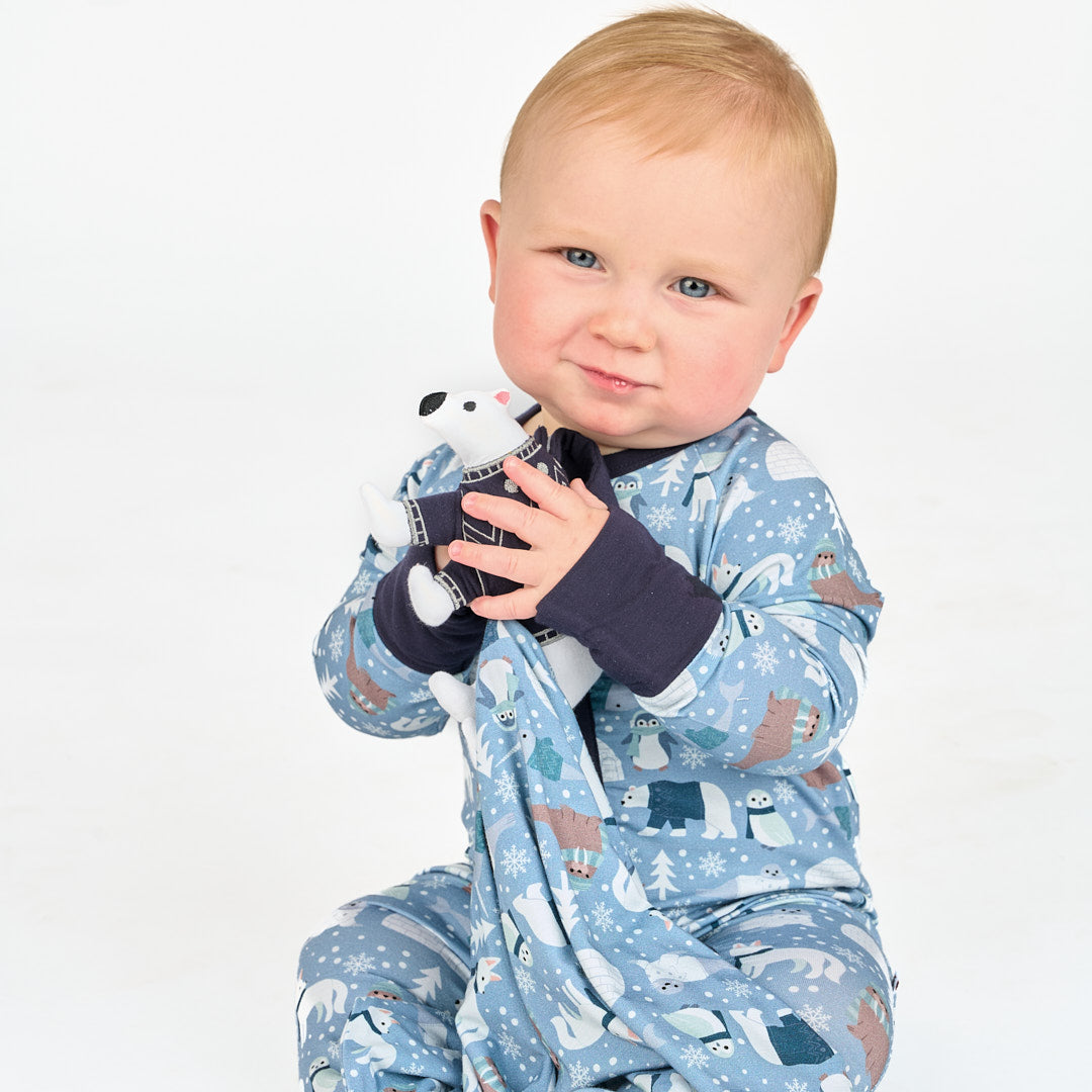 Baby sitting in white background with polar pals pajama convertible featuring polar bears